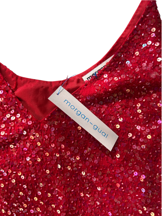 Close-up of a red sequined garment with a white Morgan-Gual brand hangtag attached near the neckline.